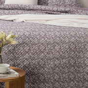 Maggie lavender quilt close-up – delicate white floral pattern on cotton